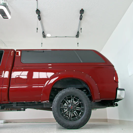 A red truck parked in a garage.